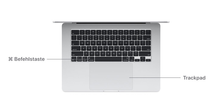 Schreibtischansicht des MacBook Air M4 mit Befehlstaste und Trackpad.