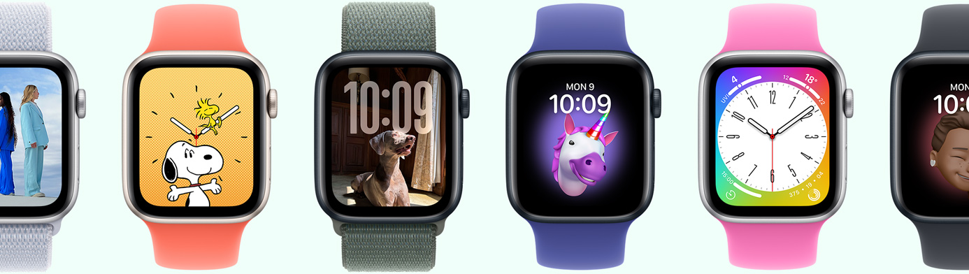 Multiple Apple Watch devices showing various watch face options