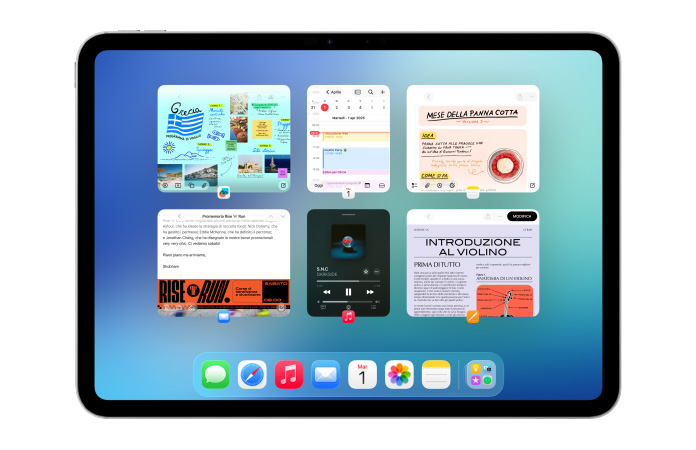 Una schermata di un iPad in orizzontale con più app come Calendario e Musica in sei finestre allineate su due righe che le mostrano tutte insieme