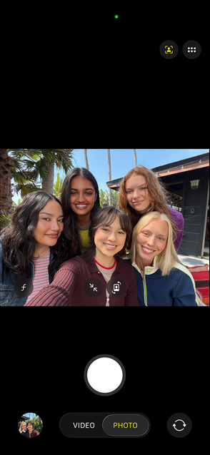 iPhone 17 front screen showing group selfie in Center stage for photos feature