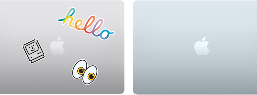 A closed silver Mac laptop covered with stickers and a closed Sky Blue MacBook Air with no stickers.