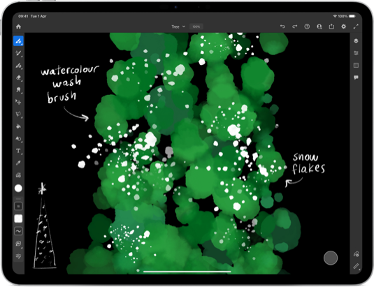 An iPad Pro showing a green watercolour Christmas tree in Adobe Fresco