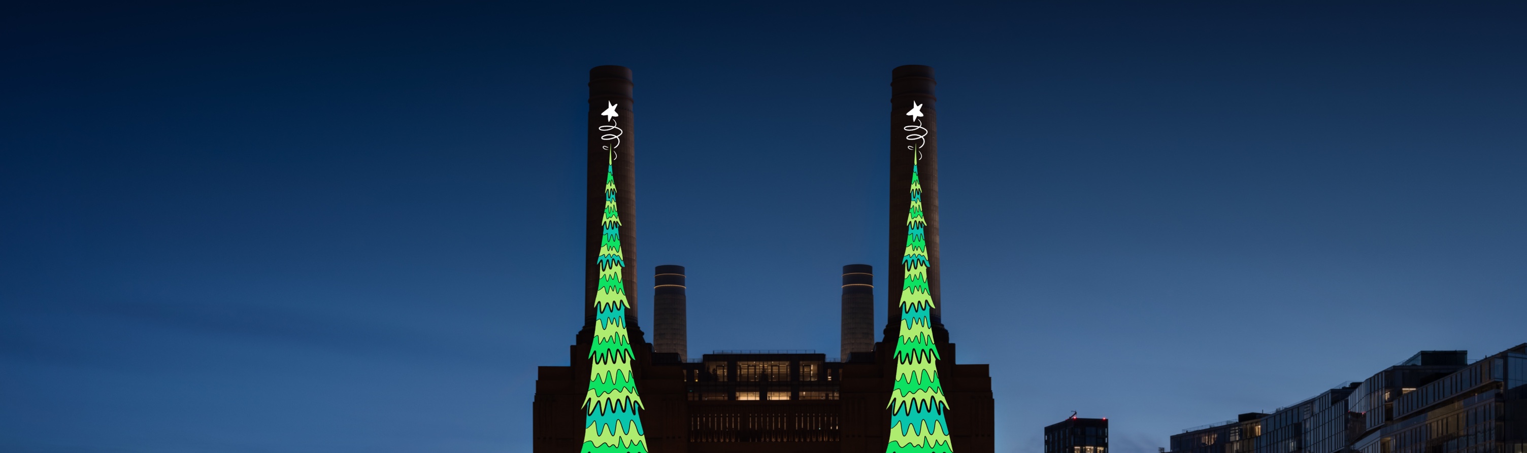 Magical Christmas tree projections on the riverside towers of iconic Battersea Power Station