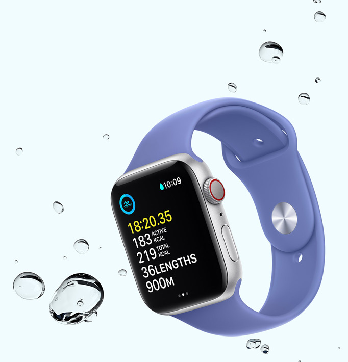 Apple Watch SE displaying a swim workout screen with water droplets near the device