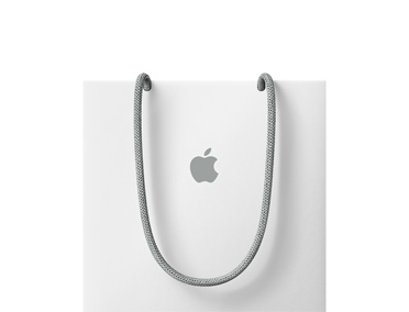 白色 Apple 提袋，灰色繩子提把，中央有灰色 Apple 標誌