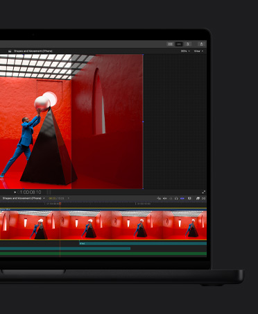 MacBook Pro 16, Video timeline of edit, man in blue suit in red room balancing giant round pearl on top of a top a black pyramid