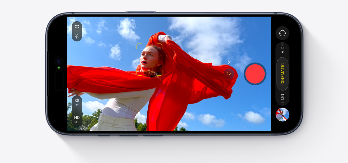 iPhone front exterior, horizontal, capturing selfie video of two people in car with Center Stage front camera, yellow squares outlining faces to show automatic framing