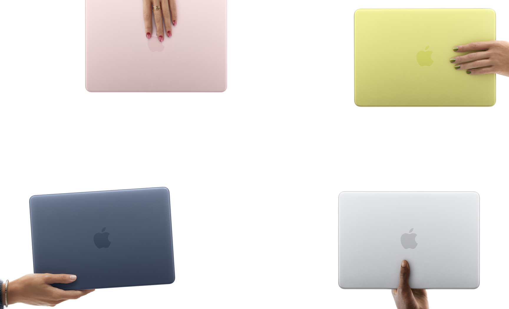 Four MacBook Neo laptops in blush, citrus, indigo and silver colours, each held in a different person's hand
