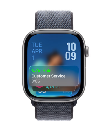 Apple Watch in Space Gray with Gray Band, Face shows Hold assist notification at bottom, date on top left, time numerals stacked at top right