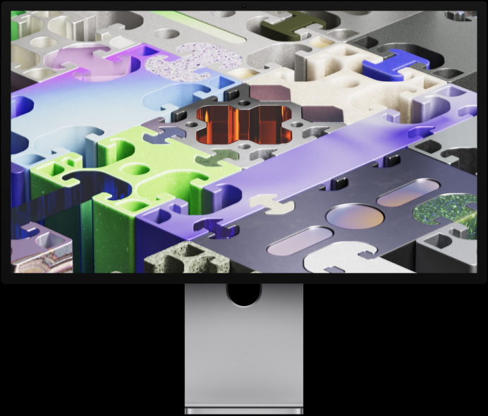 Face avant d’un Studio Display XDR avec un fond d’écran tridimensionnel évoquant un puzzle